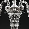 Central ornate terminal of the antique sterling silver candelabra