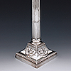 Silver candelabra base foot decorated in chased swags and urn