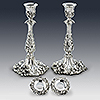 Both antique silver candlesticks showing detachable sconces 