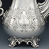 Lower profile of coffee pot showing engraved cartouche with floral engraving