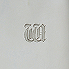 Close up of engrave d initials to silver coffee pot