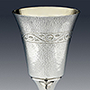Bordering engraved leaves to top rim of silver goblet