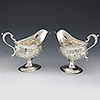 Matched pair of chased sterling silver antique sauce boats 