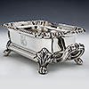 Two handled silver sauce tureen with four claw and acanthus leaf feet