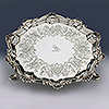 Detail central hand engraved symmetrical pattern to silver waiter