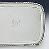 Corner detailing flue de lis border with central hand engraved monogram