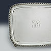 Left side detailing tray perimeter with central monogram
