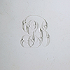 Close up hand engraved monogram GB to center of silver teapot stand