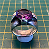 Damaged ring with chipped gemstone