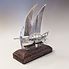 Silver maltese sailing boat